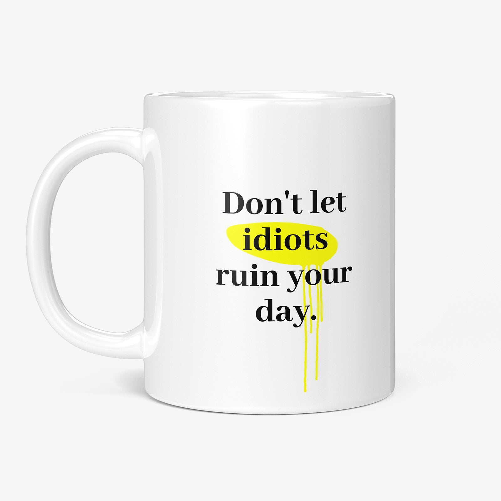 Get inspired by the quote, "Don't let idiots ruin your day" on this 11oz white glossy coffee mug with the handle on the left.