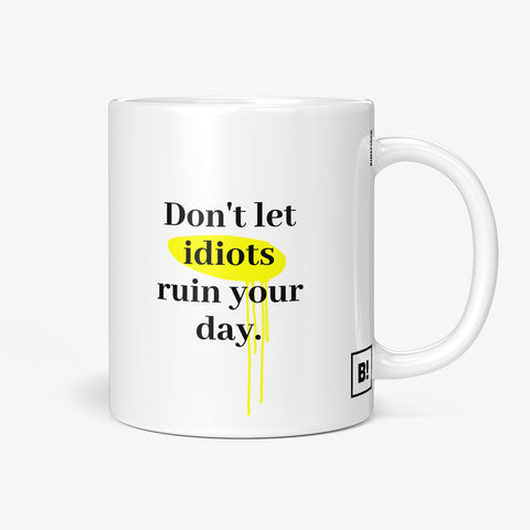 Get inspired by the quote, "Don't let idiots ruin your day" on this 11oz white glossy coffee mug with the handle on the right.