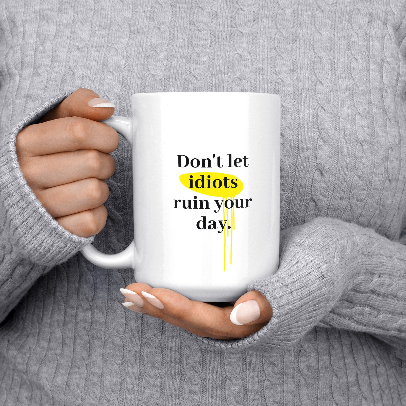 Get inspired by the quote, "Don't let idiots ruin your day" on this 15oz white glossy coffee mug with the handle on the left.