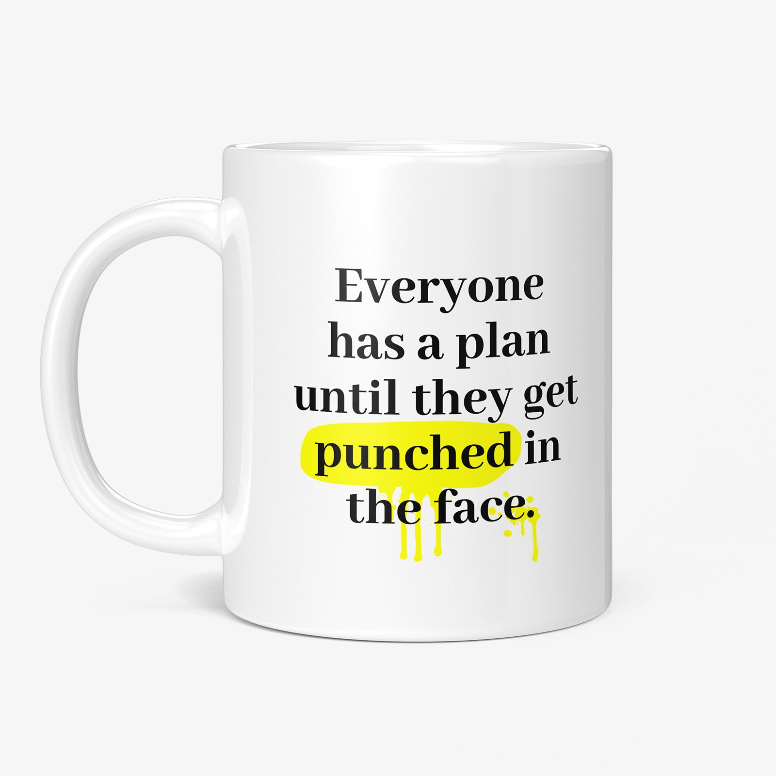 Be inspired by Mike Tyson's famous quote, "Everyone has a plan until they get punched in the face" on this white and glossy 11oz coffee mug with the handle on the left.