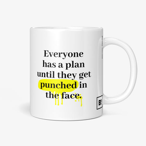 Be inspired by Mike Tyson's famous quote, "Everyone has a plan until they get punched in the face" on this white and glossy 11oz coffee mug with the handle on the right.