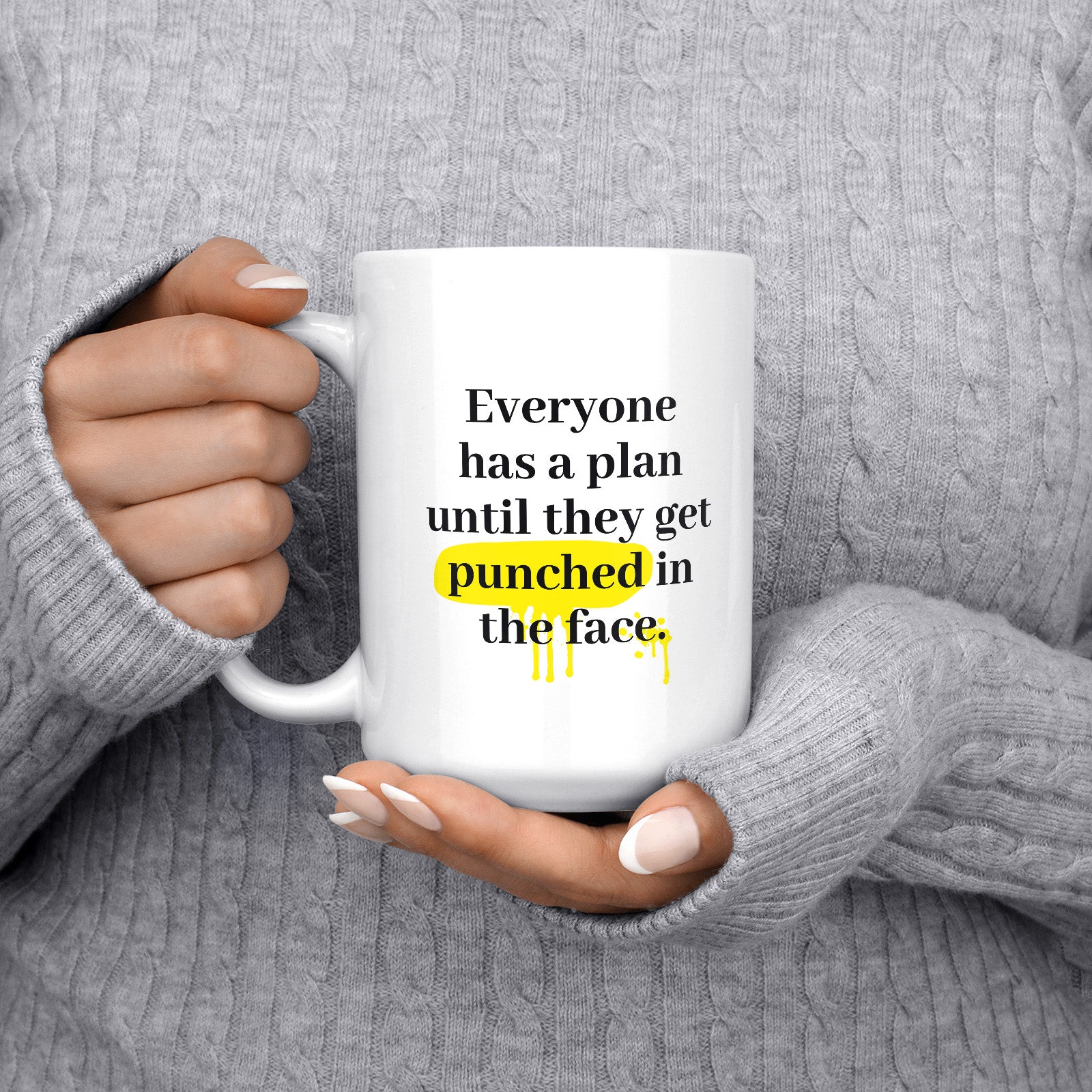 Be inspired by Mike Tyson's famous quote, "Everyone has a plan until they get punched in the face" on this white and glossy 15oz coffee mug with the handle on the left.