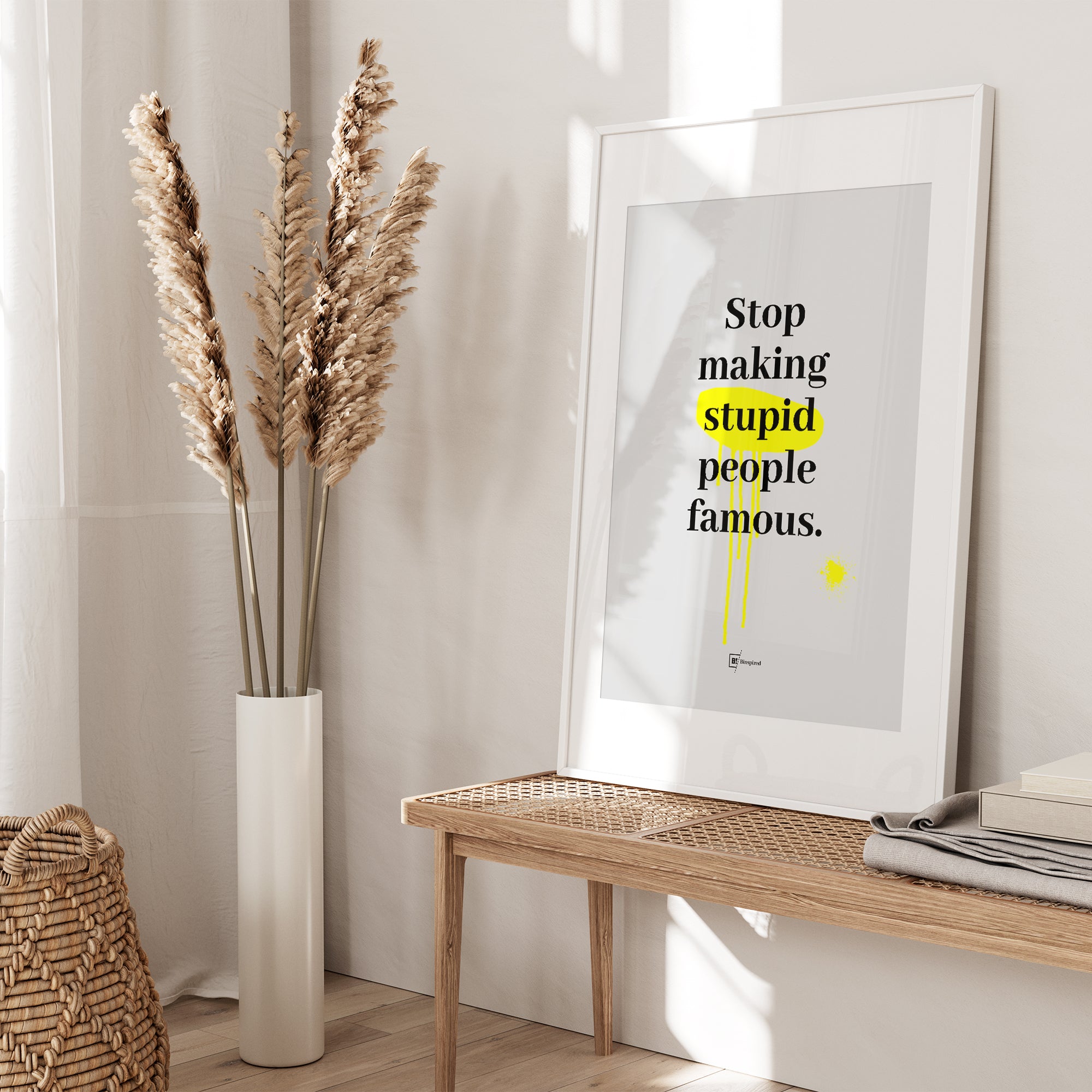 Be inspired by our "Stop making stupid people famous" quote art print! This artwork was printed using the giclée process on archival acid-free paper and is presented in a white frame with passe-partout that captures its timeless beauty in every detail.