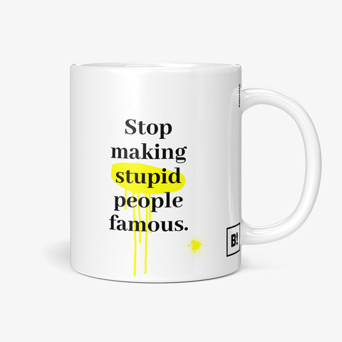 Get inspired by the quote, "Stop Making Stupid People Famous" on this 11oz white glossy coffee mug with the handle on the right.