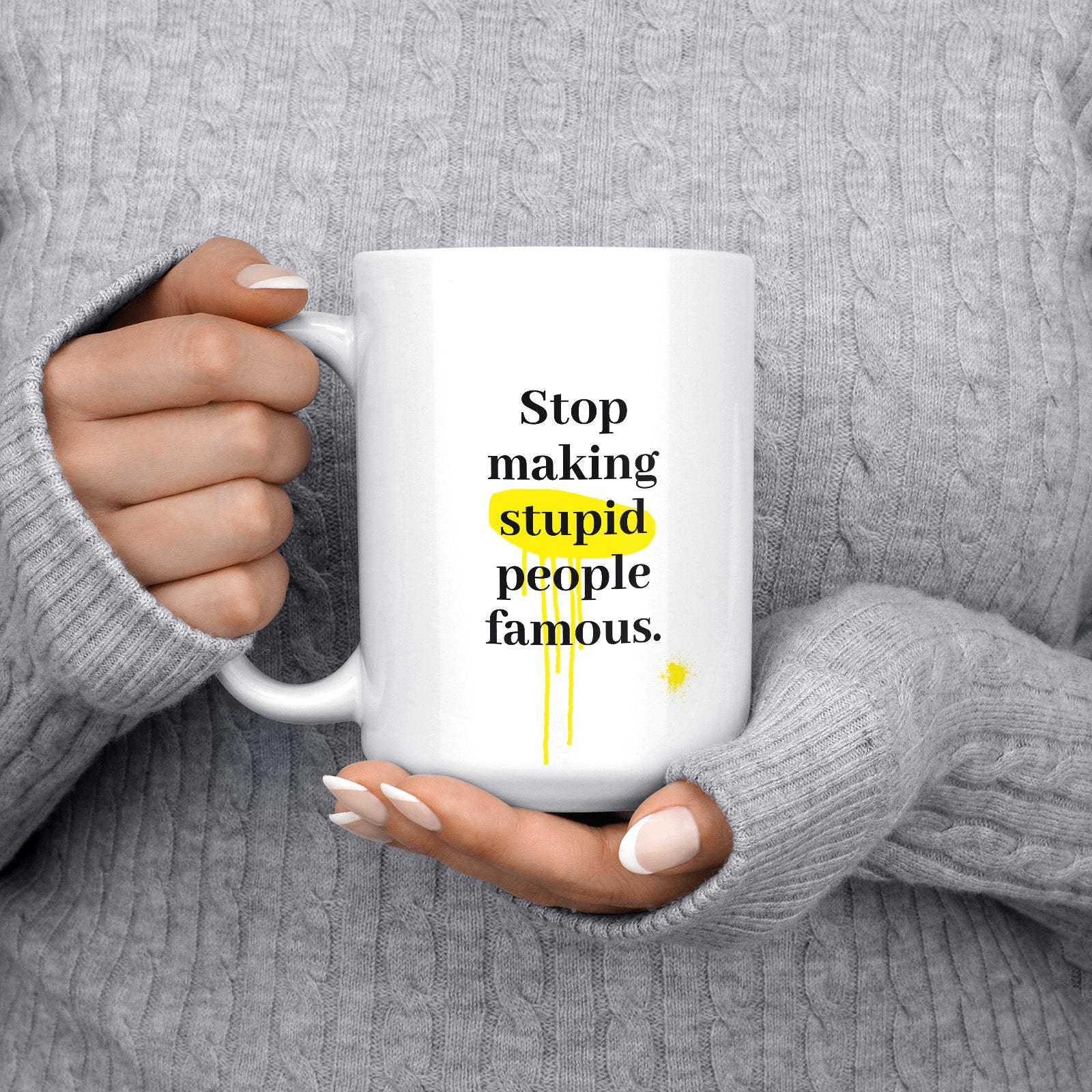 Get inspired by the quote, "Stop Making Stupid People Famous" on this 15oz white glossy coffee mug with the handle on the left.
