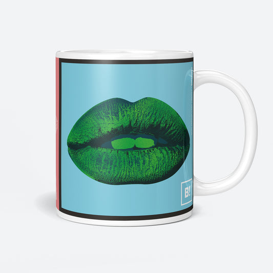 Right side view of the Mon Amour Lady Liberty 15oz coffee mug showcasing striking red kiss, purple background, and Liberty in pink.